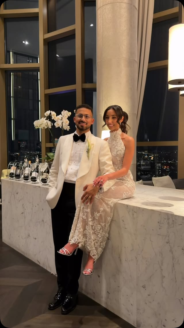 A proposal at Level 80 overlooking the city lights
