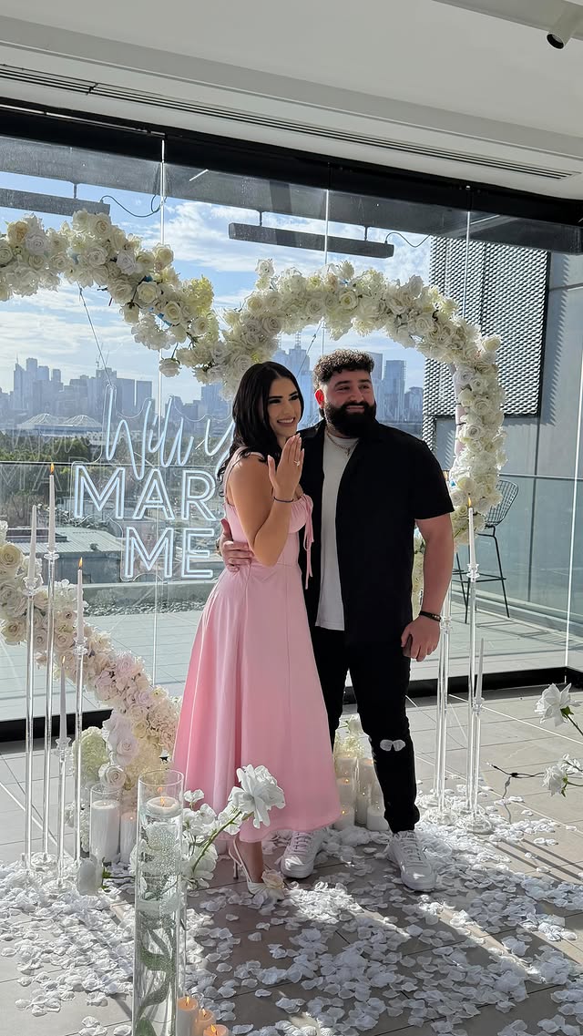 A surprise proposal styled with candles and flowers